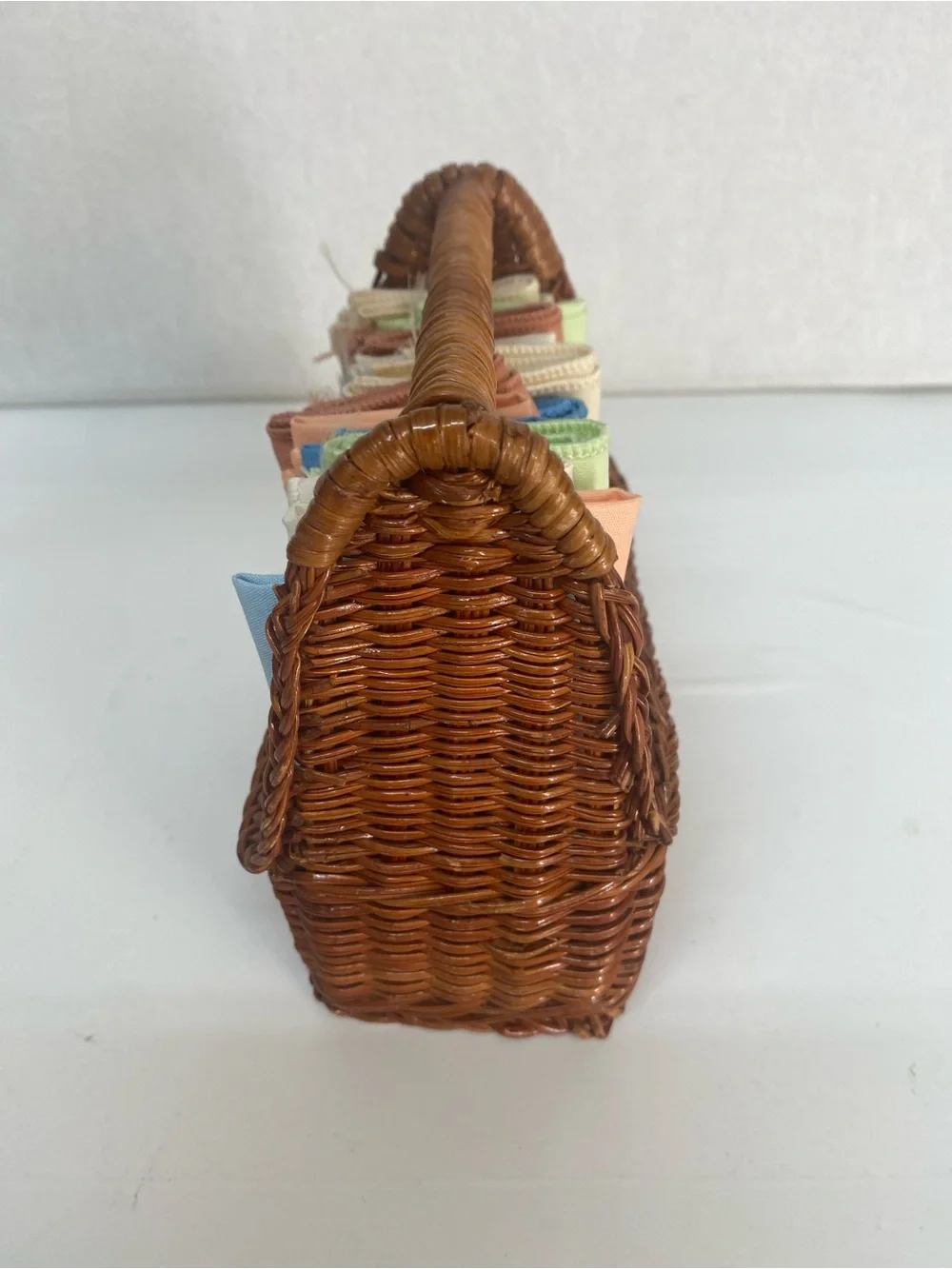 Wicker Basket Woven Rattan with Assorted Pastel Linens Cloths Storage Dainty